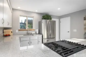 Kitchen. Gas cooktop has a griddle feature.