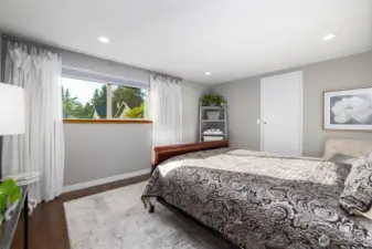 Primary bedroom, with a walk-in closet and private, updated 3/4 ensuite bathroom.