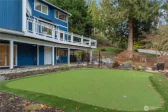 Putting green and garden with raised beds.