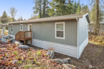 Back of the home with back entrance in view