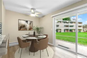 Spacious dining room with sliding glass door to patio and extensive grounds!