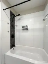 Updated full bathroom with tub and shower.