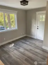 Living room area with the vinyl plank flooring.