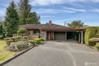 Large driveway and carport for off-street parking.