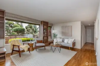 Living room to the left of the entrance looking out at Wetmore Avenue.