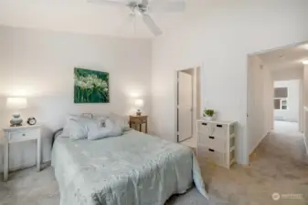 Spacious primary bedroom with freshly cleaned carpets and the entire condo was just painted inside. Door on the right is the attached bathroom.