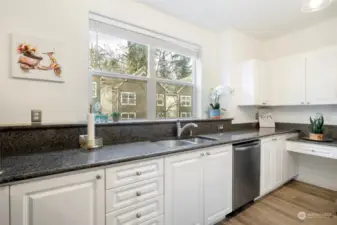 Large kitchen with plenty of cabinet space.  Granit countertops and picture window. Stainless steel appliances.