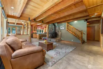 Cozy wood stove on rock hearth adds ambiance & charm