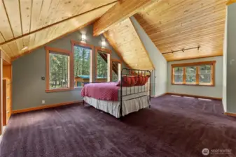 Primary bedroom designed for a large cabinet behind bed