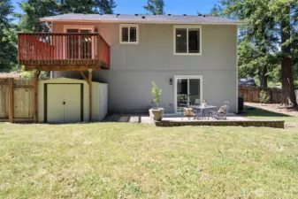 Backyard with inviting patio and deck