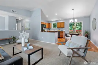 The Living Room opens to the Dining Room and Kitchen