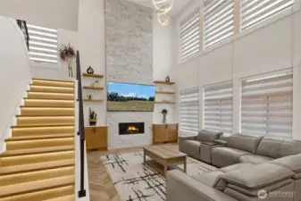 stacked stone gas fireplace that is floor to ceiling