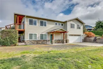 This spacious home is set at the top of a quiet cul de sac, Cedar Lane.  The lot is deep with an additional orchard and garden area to the right of the photo beyond the house.