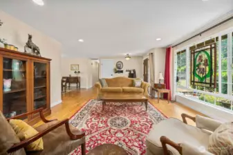 Natural light pours through the large picture window in the formal living room.