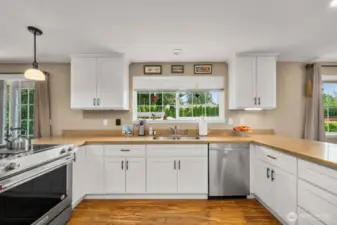 Such a great kitchen, lots of cabinets and counter space and wonderful view of the back yard.