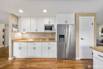 Perfect space for a coffee bar or serving a buffet line! Pantry next to the fridge.  An additional walk in pantry space off the laundry room.  So much storage!