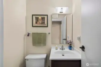 Half bath off the laundry room, also   close to family room.