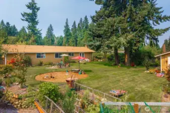 Plenty of back yard fun! Room for games, gardening and a big fire pit where you can relax and enjoy