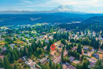 Aerial shot shows how big the yard is and the Mountain in the back ground which you have a peek a boo view of from the front yard.
