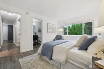 The primary suite boasts ample room for a king-sized bed, plus a walk-in closet and an ensuite bathroom.