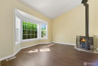 Light and bright with high ceilings, natural light and the traditional wood burning stove makes this home feel both spacious and cozy.