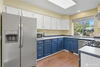 The kitchen offers stainless steel appliances and gas range.
