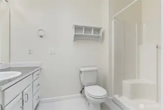 The attached primary 3/4 bathroom with walk in shower.