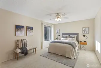 The generously proportioned primary bedroom suite offers space for a king-size bed, large furniture and designated seating areas.