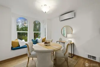 Spacious dining room with tall ceilings, large windows and mini split!