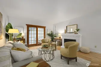 Light and airy living room with propane fireplace. The fireplace keeps the downstairs warm and toasty all winter.