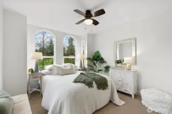 2nd bedroom with large windows and tall ceilings.