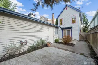 Entry to paved alley and detached one care garage.