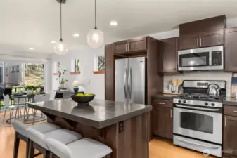 New stainless steel appliances, ample storage in the cherry wood cabinetry and a half bath on the same floor.