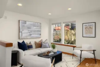 Living room features Bamboo hardwood floors, gas fireplace hookup and fresh paint.
