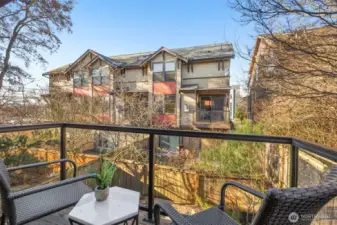 Private balcony with glass paneled railings.