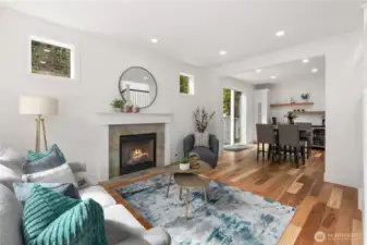 Circular Floorplan Leads You to A Secondary Living Room and Dining Room on the Main Level. Built-in Beverage Counter with Floating Shelves and Two Beverage/Wine Fridges.