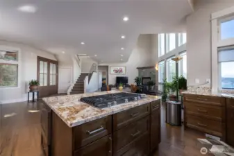 View of kitchen looking back to the living area. The second floor was pulled back to allow for oversize vaulted ceilings in the main living space.