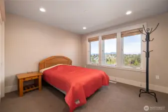 This is the 3rd bedroom in the home, also upstairs. This one has a bit of that gorgeous view.