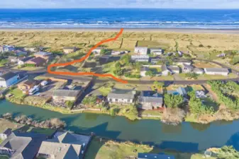 The public beach trail is just a block to the west...