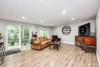 A family room that leads you to the back patio.