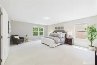 Retreat to the luxurious primary bedroom, complete with plush new carpet, neutral tones, and expansive windows. There's ample room for a sitting area or home office setup—your personal haven to unwind in peace and privacy.