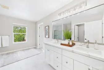 The double-sink vanity offers plenty of space for two, highlighted by quartz countertops, updated fixtures, and custom lighting. Thoughtful details bring a luxurious spa feel to your everyday routine.    The double-sink vanity offers plenty of space for two, highlighted by quartz countertops, updated fixtures, and custom lighting. Thoughtful details bring a luxurious spa feel to your everyday routine.  The double-sink vanity offers plenty of space for two, highlighted by quartz countertops, updated fixtures, and custom lighting. Thoughtful details bring a luxurious spa feel to your everyday routine.