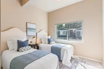 Updated upper bedroom with vaulted ceilings and new carpet.