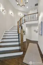 Exquisite custom stairway with ironwork from Italy.