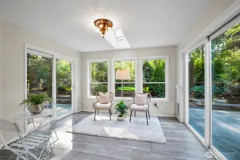 Conservatory / sunroom is just off the kitchen.  Could be used as your breakfast nook or art studio.  Lovely lighting and windows on three sides.