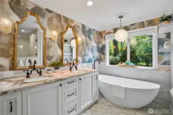 Fully remodeled bathroom with heated tile flooring (that extends into the shower) and backlit Italian onyx counter and window sill surfaces.