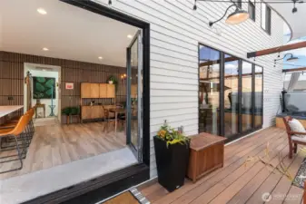 8ft wide french doors open onto the ground level deck bringing the inside out.