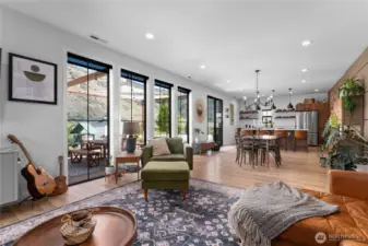 Open floor plan downstairs with four 8 ft tall windows looking out over the Columbia River