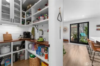Pantry with plenty of storage just off the kitchen.