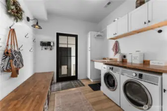 Large mudroom/laundry room just off the kitchen.